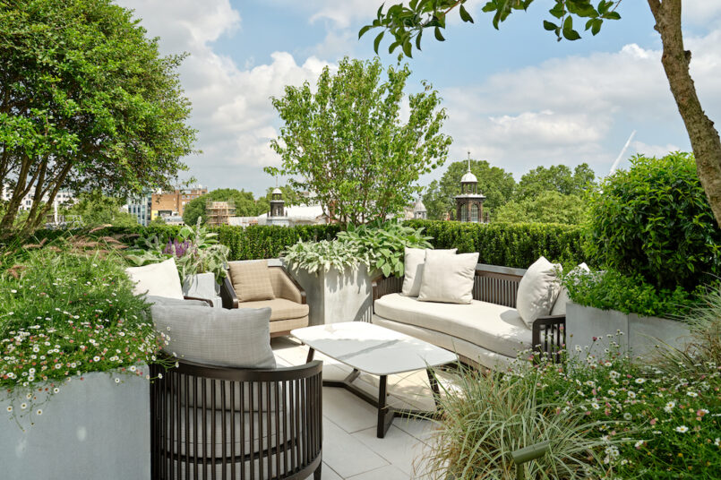 white outdoor furniture set in garden at luxury london penthouse