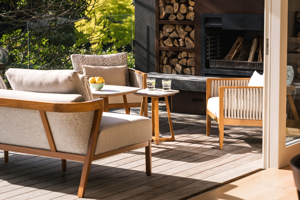 outdoor garden furniture set on patio by fireplace