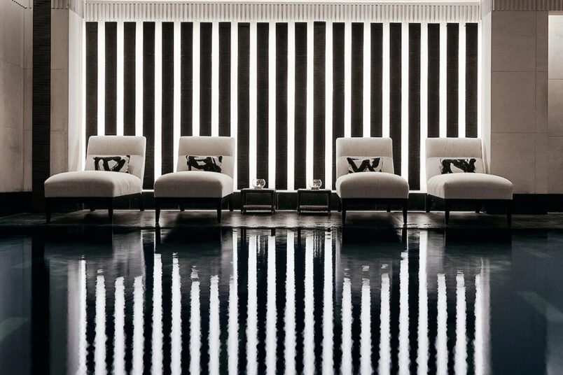 4 beige loungers by the water at amam spa at the connaught